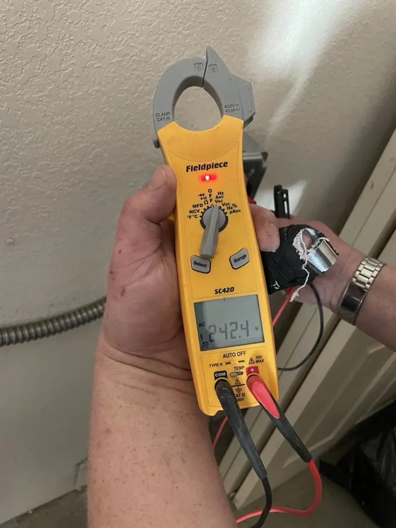 Voltage testing with clamp meter during Ceiling Fan Installation in Chalco